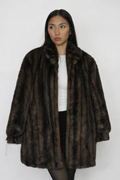 Plush faux-fur coat with a rich striped finish.
