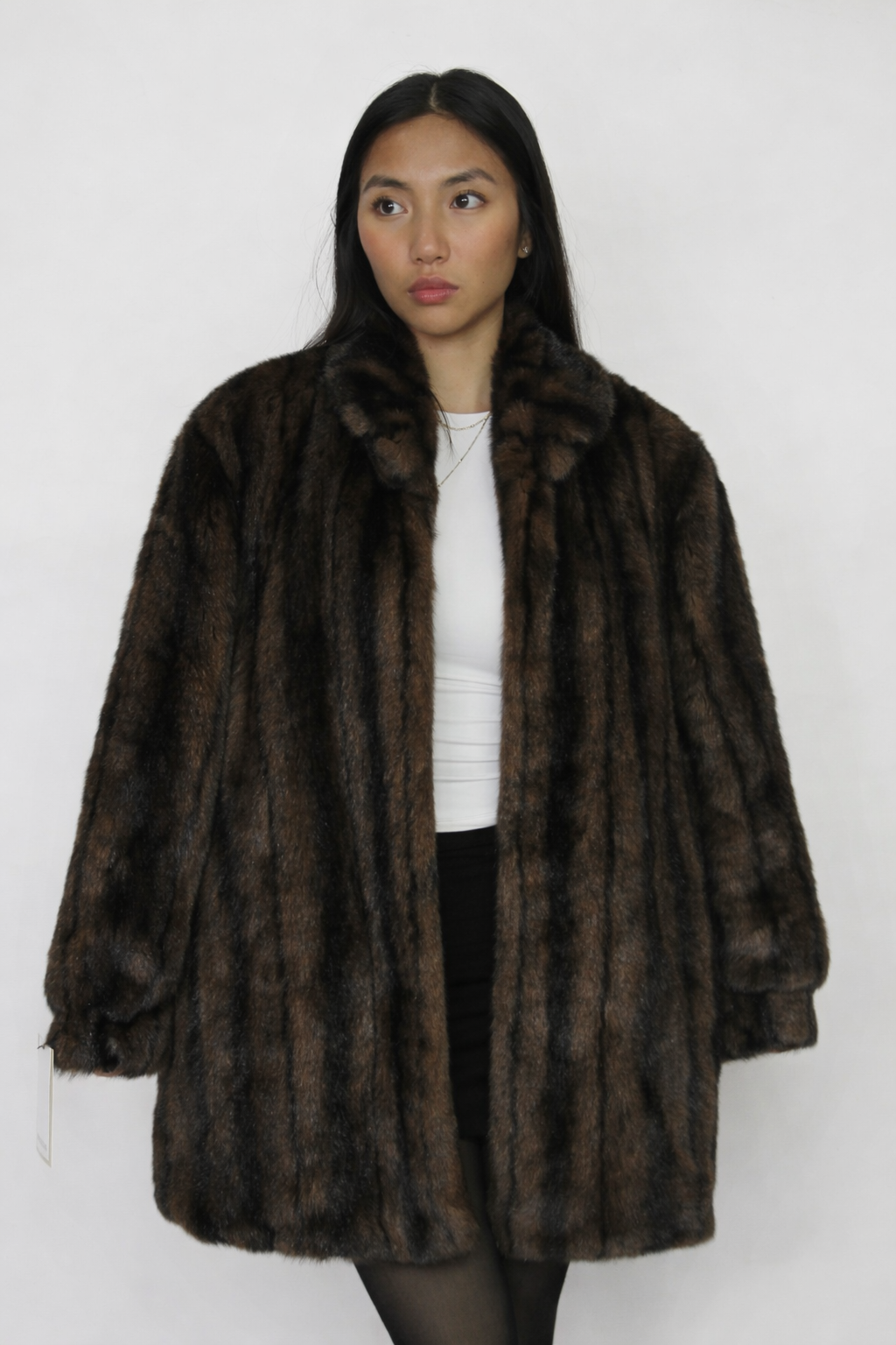 Plush faux-fur coat with a rich striped finish.