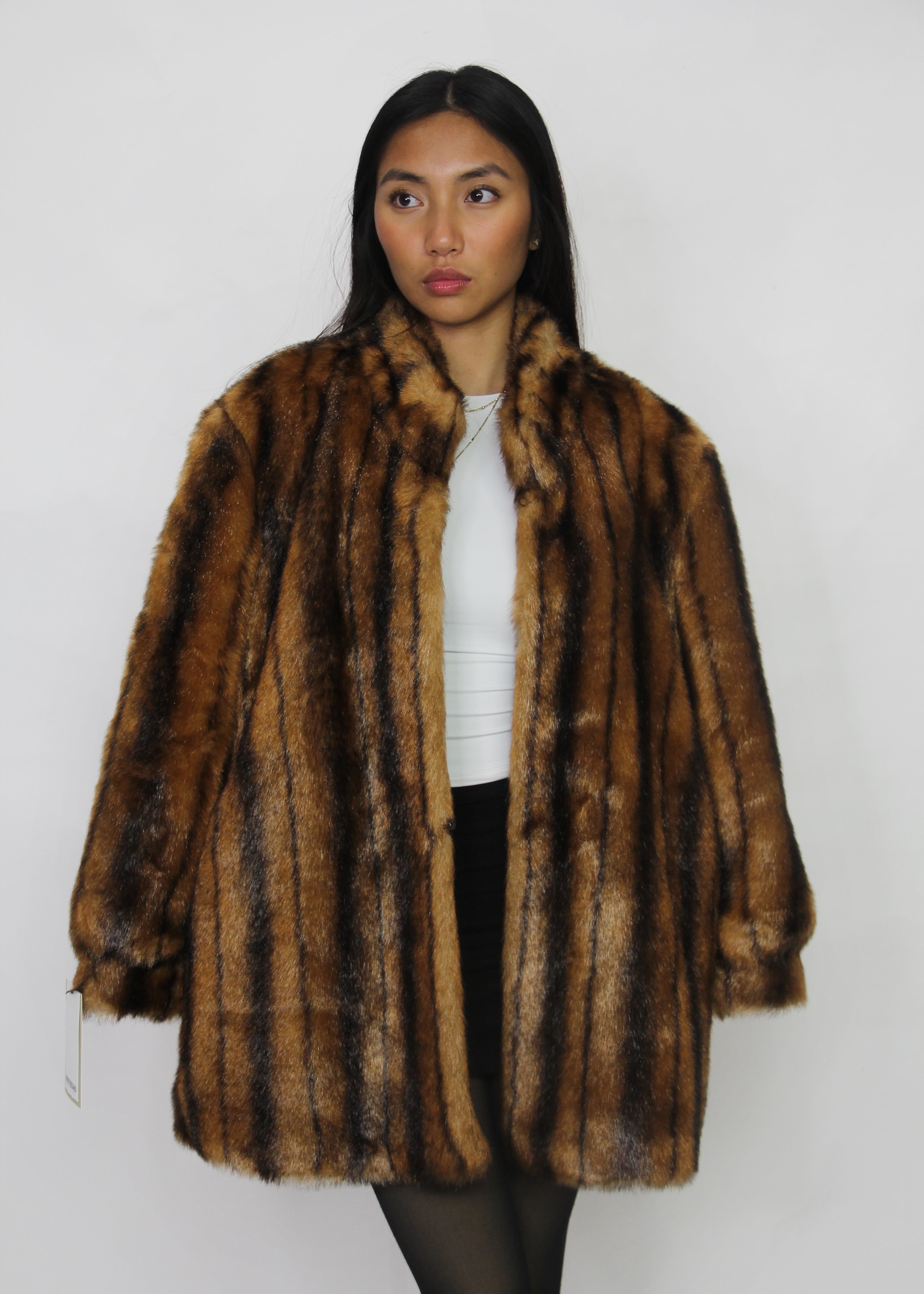 Plush faux-fur coat with a rich striped finish.